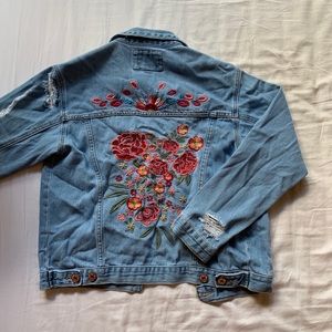 Distressed jean jacket with flower embroidery